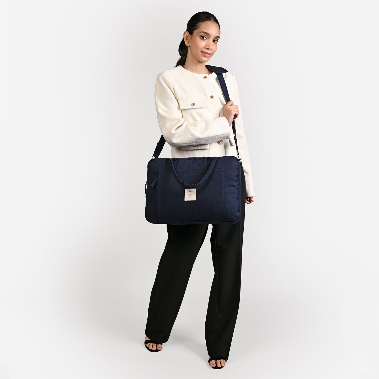 Blue Sustainable Laptop Bag made from Canvas fabric female model image with cross body handle angel
