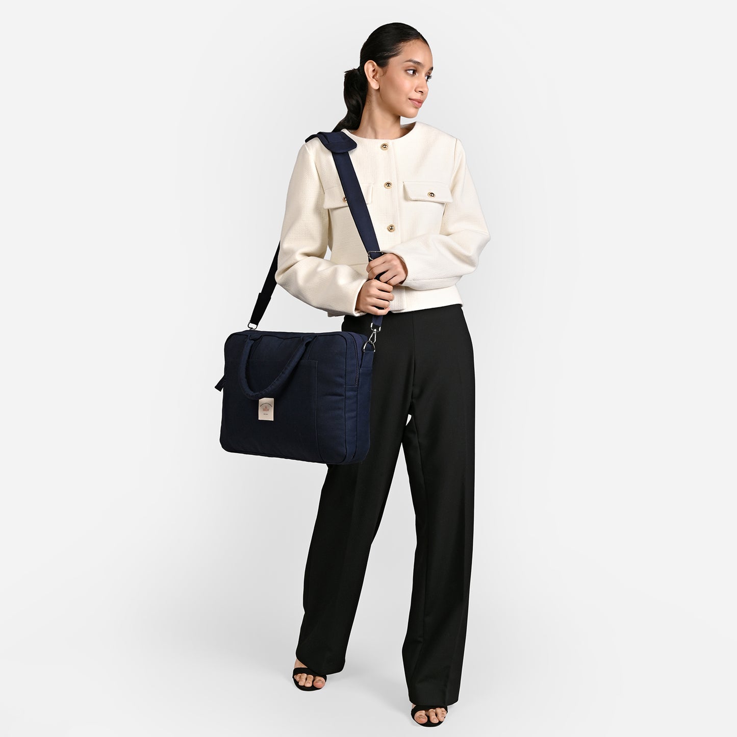 Blue Sustainable Laptop Bag made from Canvas fabric female model image with side handle angel