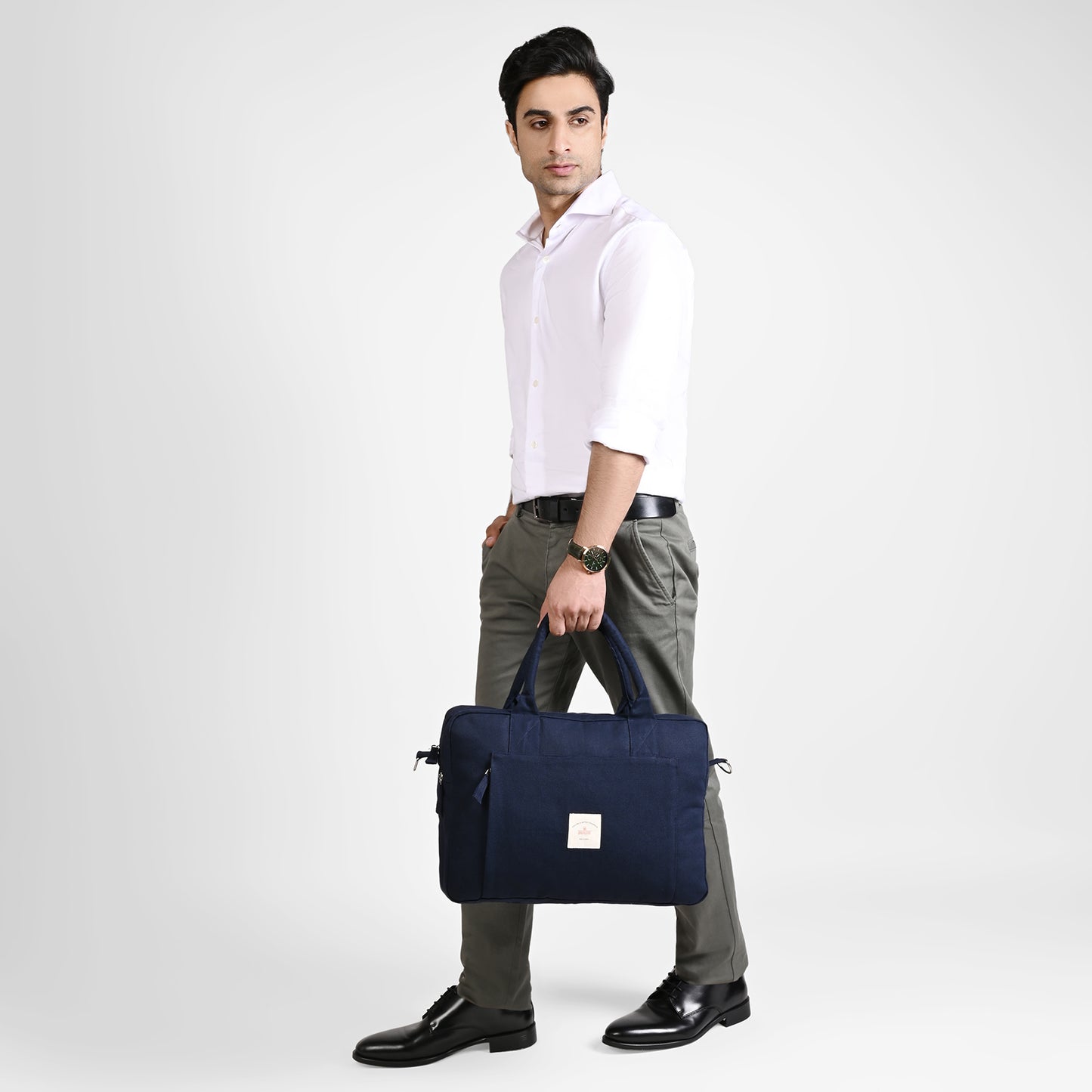 Blue Sustainable Laptop Bag made from Canvas fabric male model image with handle angel