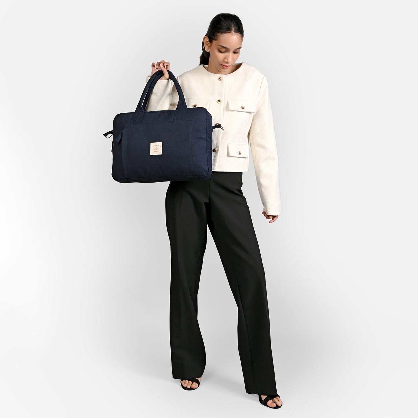 Blue Sustainable Laptop Bag made from Canvas fabric female model image with handle angel