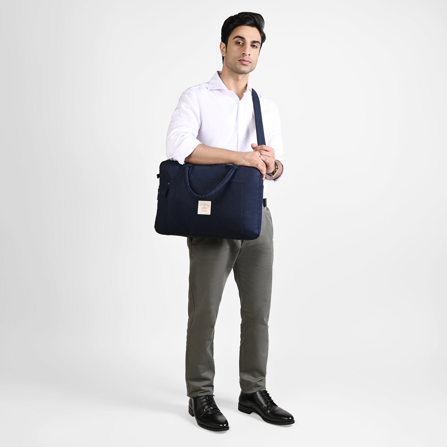 Blue Sustainable Laptop Bag made from Canvas fabric model image with crossbody handle angel 